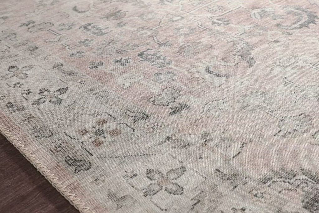 Featuring soft motifs in a carefully curated color palate of blush, pink, ivory, and hints of grey, the Hathaway Blush / Multi area rug captures the essence of one-of-a-kind vintage or antique area rug at an attractive price.