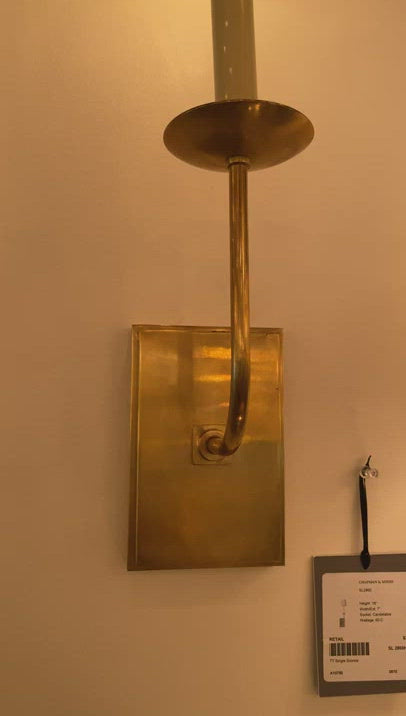 The TT Single Sconce by Visual Comfort is sleek and timeless, bringing a gorgeous source of light to any bathroom, hallway, or other area needing extra light.   Designer: E. F. Chapman