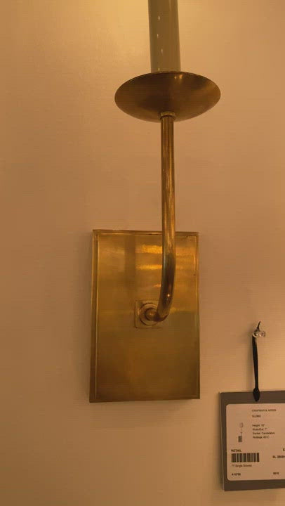 The TT Single Sconce by Visual Comfort is sleek and timeless, bringing a gorgeous source of light to any bathroom, hallway, or other area needing extra light.   Designer: E. F. Chapman