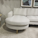Fun while sophisticated, the option to flip the direction of this Freya Flip Sofa - 97" - Knoll Sand delivers clever adaptability to the modern living room. Upholstered in a textural boucle, cone-tapered wooden legs add a sense of lightness to any living room or lounge area.  Overall Dimensions: 96.00"w x 64.00"d x 34.00"h