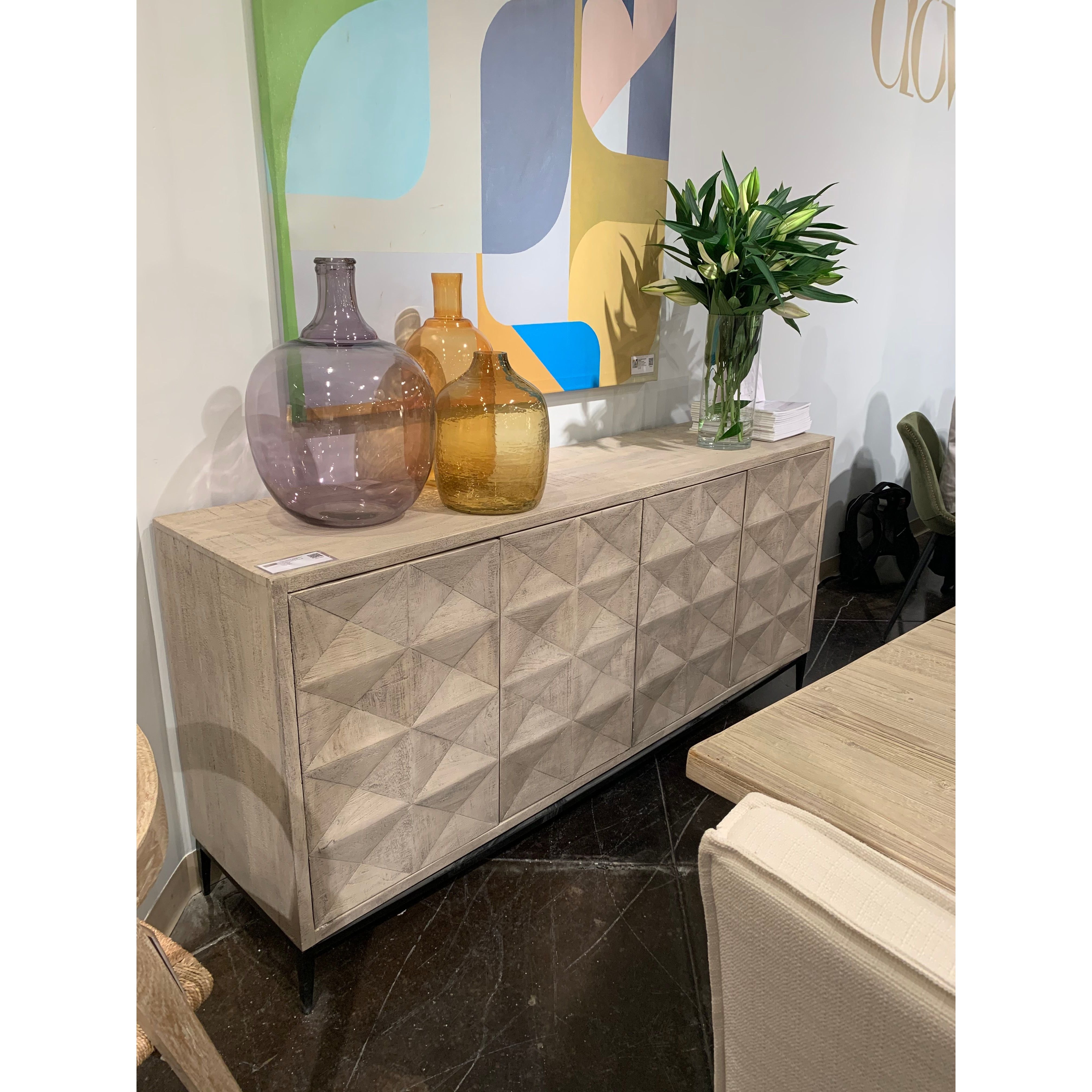 We love the textures found on this Montero Sideboard.  A wash of white and a light distressing add a whisper of color and texture to enhance this striking sideboard’s finish.   RECYCLED PINE ON IRON BASE GREY WHITE WASH FINISH Size: 84"l x 19"d x 37"h