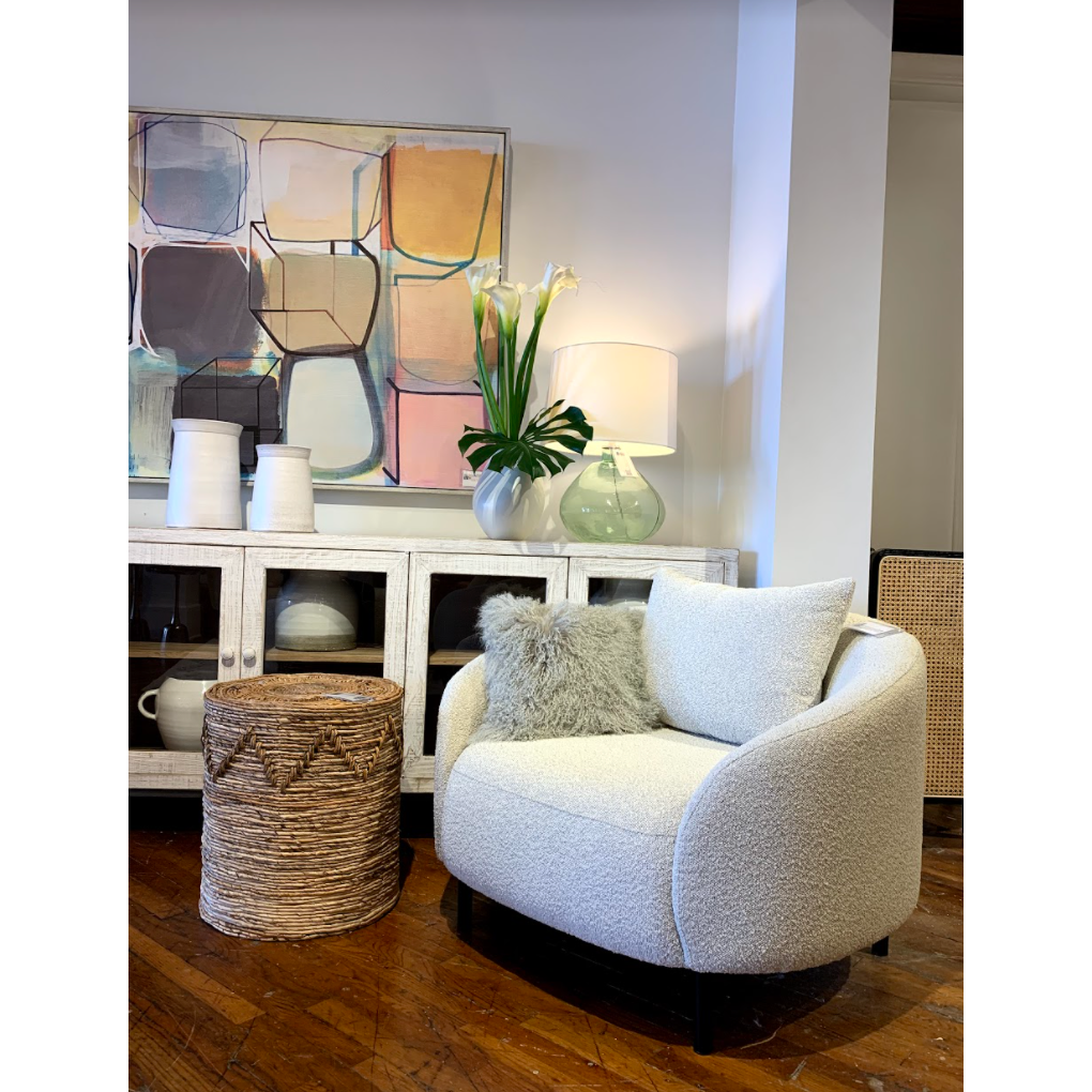 We love the gorgeous light sand boucle upholstery paired with the black, metal legs on this Rani Occasional Chair. Comfortable and stylish, we'd love to see this in your living room or lounge area! 