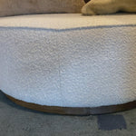 This round ottoman of textural cream boucle can be placed just about anywhere, bringing with it a hip retro vibe.  Overall Dimensions: 36"w x 36"d x 14.5"h