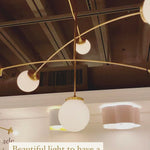 We find art in a chandelier with the arms of this Prescott Medium Mobile Chandelier by Visual Comfort. Add to your living room, kitchen, or other large area to bring a unique, modern feel to your space. 