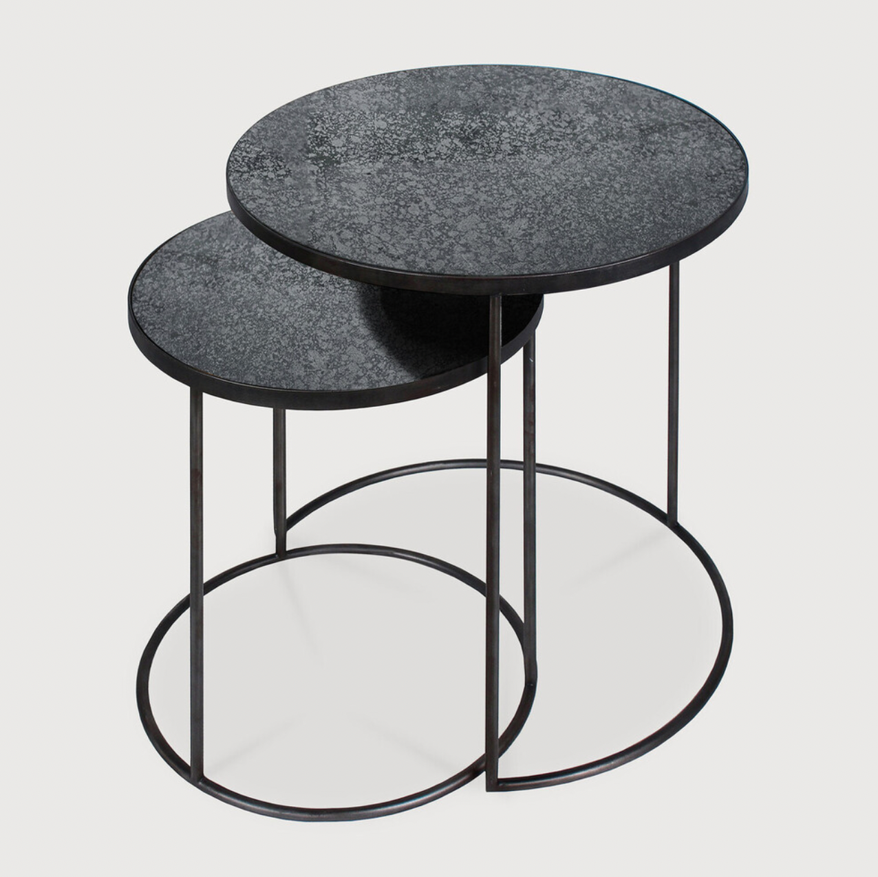 Featuring a heavy aged mirror surface, this Charcoal Nesting Side Table Set brings a unique look to any space. Place beside the sofa, sitting next to your bed, or as a complementary piece to a work of art, its adaptability offers many possibilities.  Dimensions: 22.5"w x 22.5"d x 27.5"h   Material: Mirror