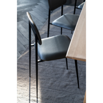 This DC Dining Chair is beautiful, minimalistic metal silhouette that would add an air of elegance to your dining table or kitchen. We love the details of the angled metal and the simplicity of this stunning chair.  Dimensions: 17"w x 19"d x 32.5"h  Weight: 19 lbs  Seat Height: 20"  Material: Metal Finish: Olive Green Leather Upholstery