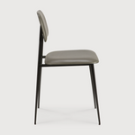This DC Dining Chair is beautiful, minimalistic metal silhouette that would add an air of elegance to your dining table or kitchen. We love the details of the angled metal and the simplicity of this stunning chair.  Dimensions: 17"w x 19"d x 32.5"h  Weight: 19 lbs  Seat Height: 20"  Material: Metal Finish: Olive Green Leather Upholstery
