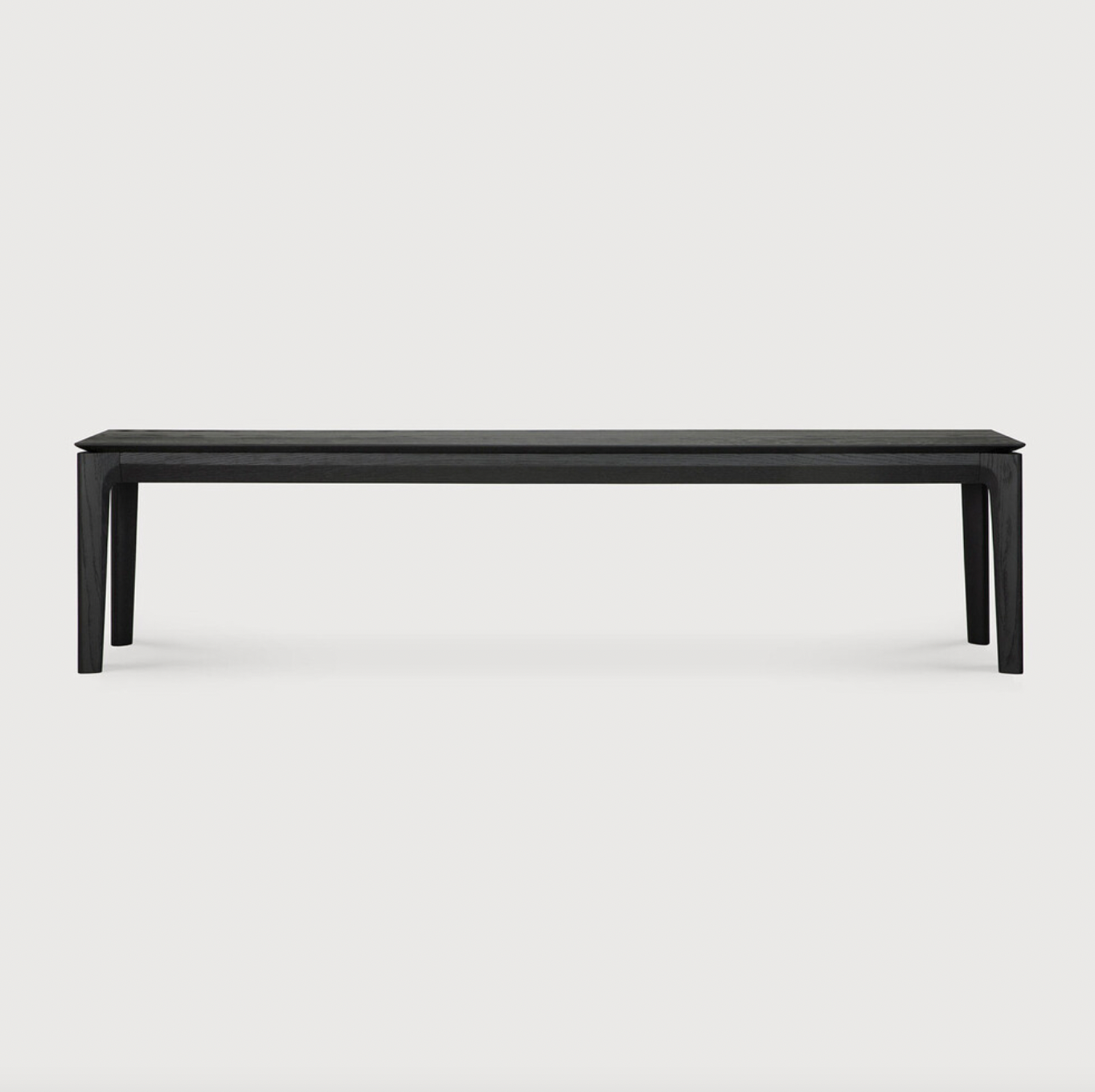 This Oak Bok Bench - Black features an airy shape with rock-solid construction,  making this piece a timeless and remarkable design to enjoy for years to come. Pair with a dining table or stand-alone against a wall, hallway, or end of the bed!  Material: Oak Finish: Oiled