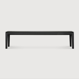 This Oak Bok Bench - Black features an airy shape with rock-solid construction,  making this piece a timeless and remarkable design to enjoy for years to come. Pair with a dining table or stand-alone against a wall, hallway, or end of the bed!  Material: Oak Finish: Oiled