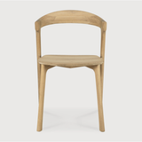 Featuring Oak Bok Dining Chair by Ethnicraft at Amethyst Home. This Oak Bok Dining Chair features an airy shape with rock-solid construction,  making this piece a timeless and remarkable design to enjoy for years to come. Pair with a dining table or stand-alone against a wall, hallway, or end of the bed! Designed by Alain can Havre
Dimensions: 20"w x 21.5"d .  Amethyst Home provides interior design, new home construction design consulting, vintage area rugs, and lighting in the Houston metro area.