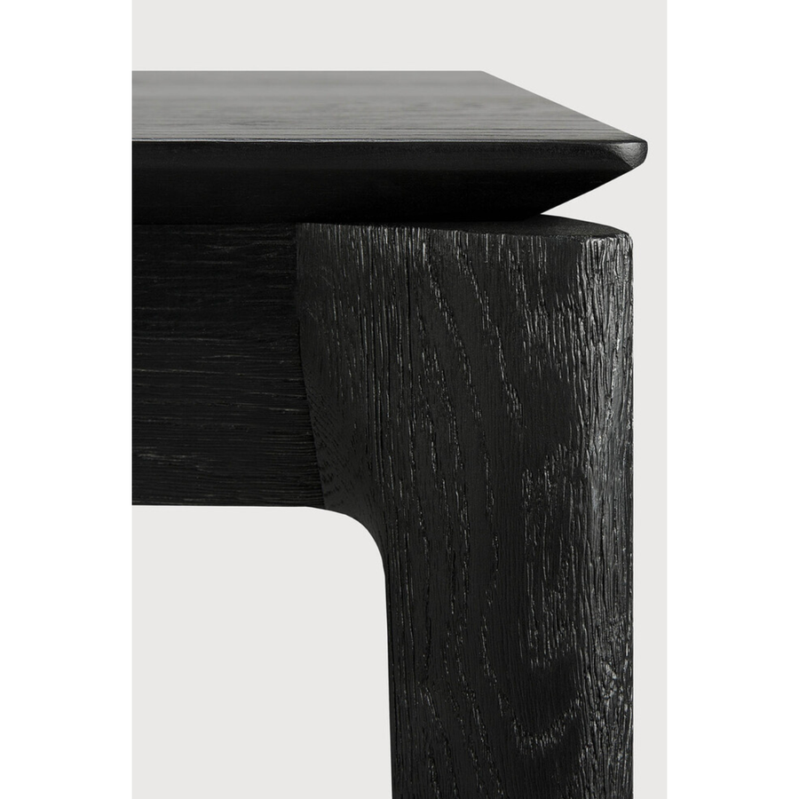 The airy shape yet rock solid construction make this Oak Bok Dining Table - Black a timeless and remarkable design to enjoy for years to come. Available in many sizes, this can fit any dining room or kitchen area.   Material: Oak, 100% Solid Wood Finish: Varnished