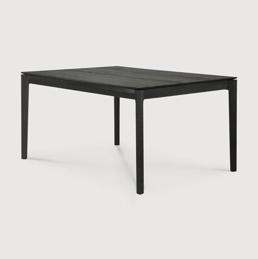 The airy shape yet rock solid construction make this Oak Bok Dining Table - Black a timeless and remarkable design to enjoy for years to come. Available in many sizes, this can fit any dining room or kitchen area.   Material: Oak, 100% Solid Wood Finish: Varnished
