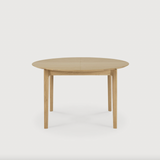 This Oak Bok Round Extendable Dining Table offers the perfect solution for adaptable dining within a smaller space. The iconic airy shape and solid construction make for a timeless design to enjoy for years to come.  Material: Oak, 100% Solid Wood Finish: Oiled