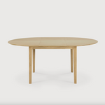 This Oak Bok Round Extendable Dining Table offers the perfect solution for adaptable dining within a smaller space. The iconic airy shape and solid construction make for a timeless design to enjoy for years to come.  Material: Oak, 100% Solid Wood Finish: Oiled