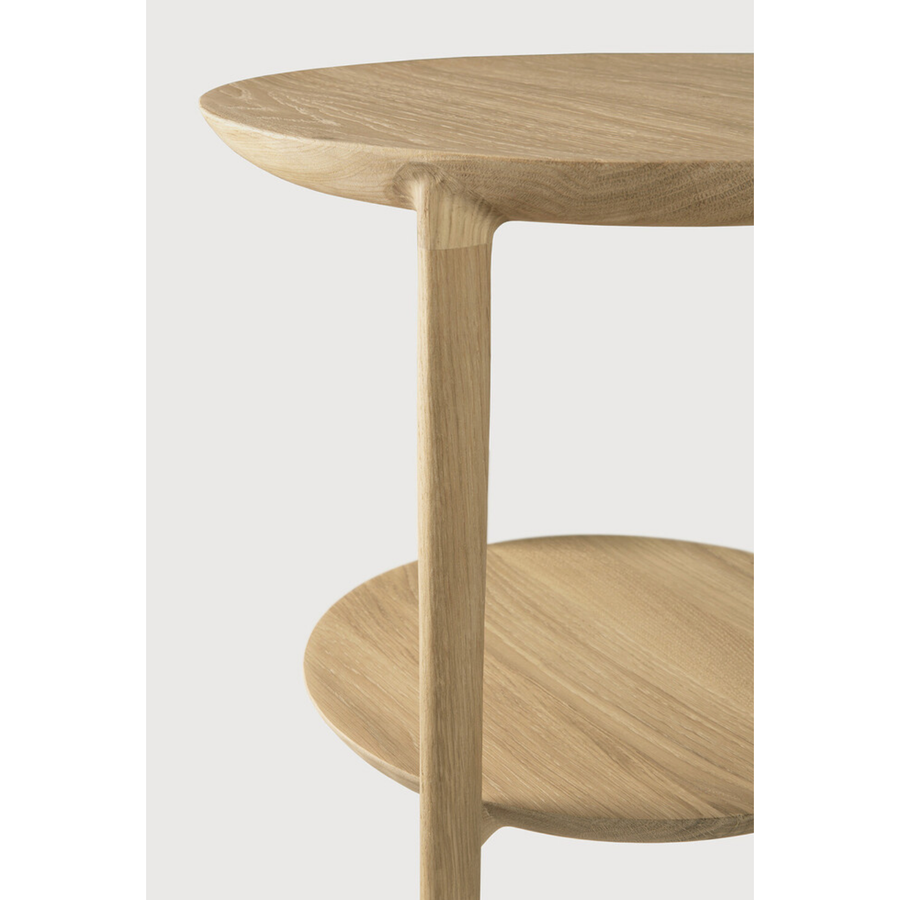 We love the sleek, timeless shape of the Oak Bok Side Table as it makes a beautiful addition to any lounge space. From art to books or plants, with the Bok side table, your object of choice has found its stage.  Dimensions: 17"w x 17"d x 20"h  Weight: 13 lbs  Material: Oak, 100% solid wood Finish: Varnished