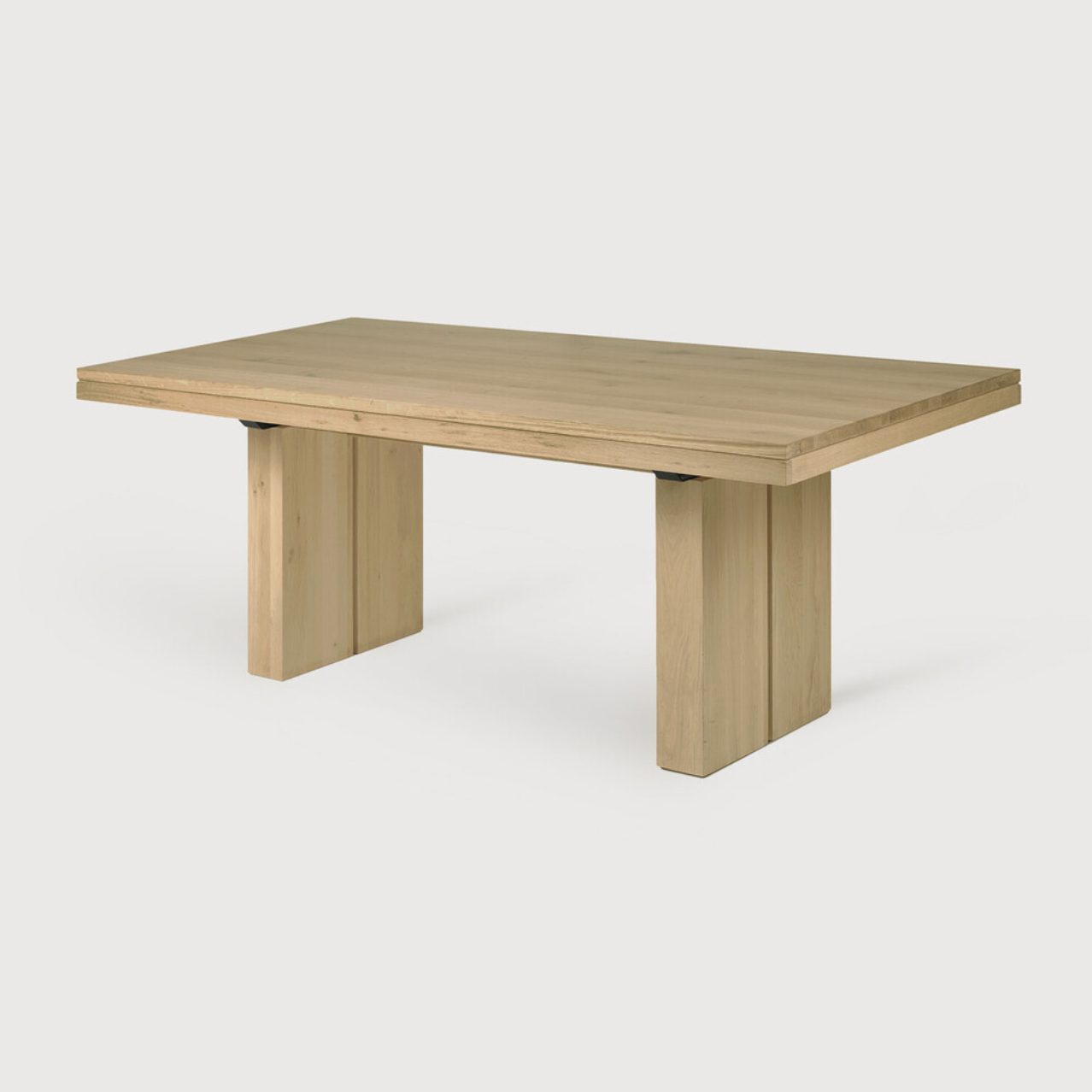 We love the solid look and pure lines of this Oak Double Extendable Dining Table.   Although the table looks heavy, it can very easily be extended single-handedly. It takes a few steps and no more than seconds to make space for whatever will be happening next in your home!  Material: Oak, 100% Solid Wood Finish: Oak  