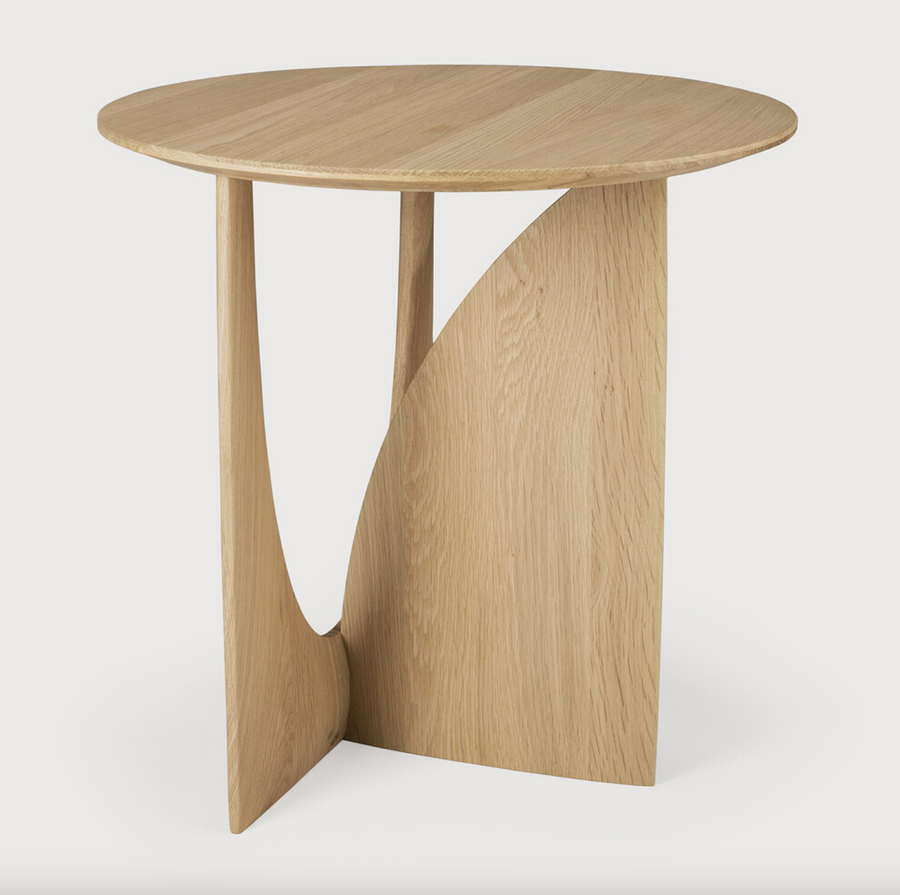 From any angle, the Oak Geometric Side Table does not only look different, it also becomes different. We love seeing this table as a sculptural accent to your living space or office.  Designed by Alain van Havre  Dimensions: 20.5"w x 20.5"d x 20"h  Weight: 11 lbs  Material: Oak Finish: Varnished