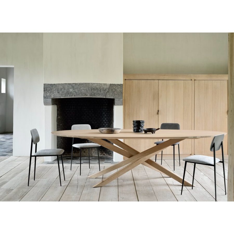 This Oak Mikado Dining Table - Oval by Alain Van Havre is all about inspiring your family to spend a little more time at the table. We love that the solid legs intertwine in perfect balance to elevate the look to any dining room or kitchen area.   Material: Oak, 100% Solid Wood Finish: Oiled