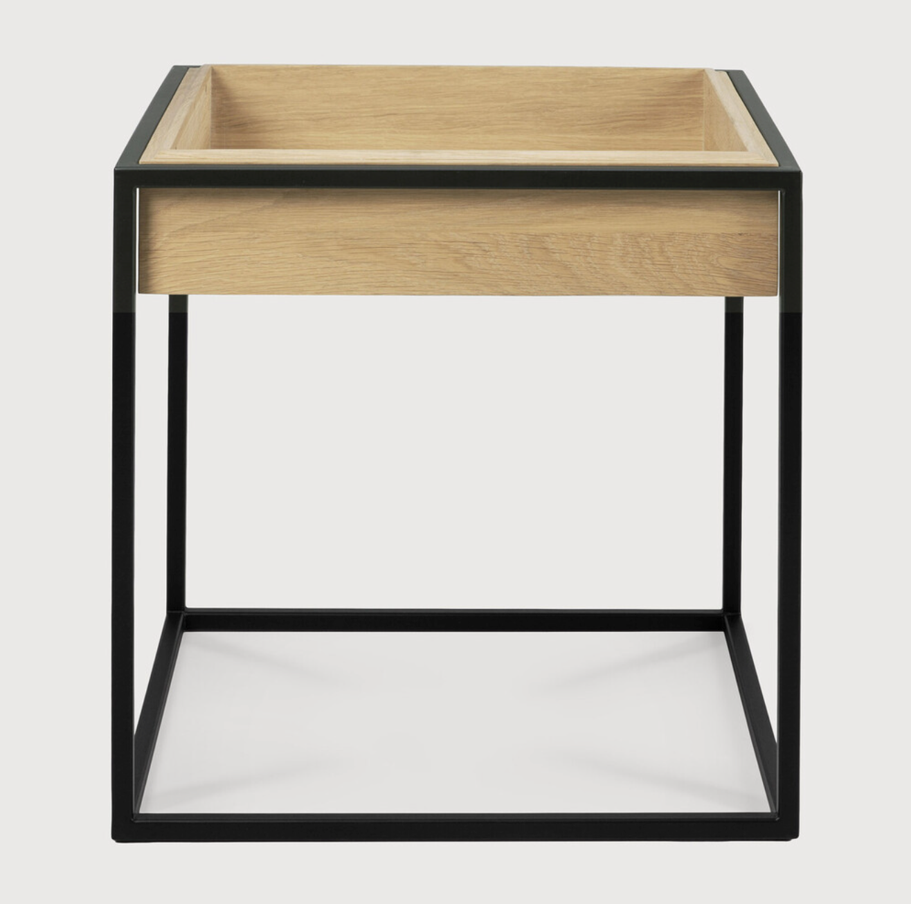 Balance and function come together in the Monolit side table. This simple, sleek table includes storage and we LOVE hidden storage! Dress up your living room or office with a piece that is both functional and stylish!  Dimensions: 19"w x 19"d x 20.5"h  Weight: 22 lbs  Material: Oak, 100% solid wood Finish: Oiled