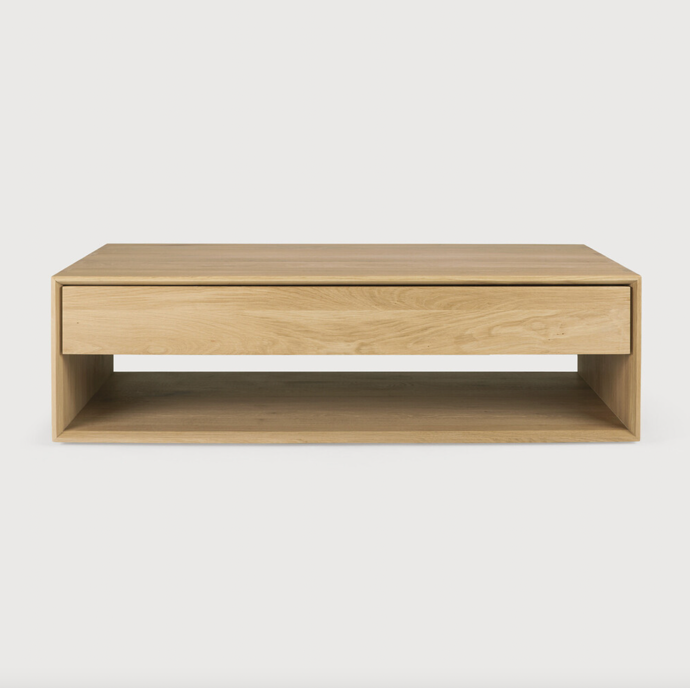 Featuring both a bottom shelf and a drawer, this Oak Nordic Coffee Table brings a functional and beautiful organic element to any living room or lounge area.   Dimensions: 47.5"w x 28"d x 14"h  Weight: 112 lbs  Material: Oak, 100% solid wood Finish: Oiled