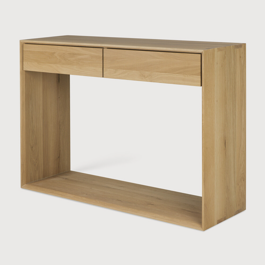 This Oak Nordic Console combines refined design with the purity of solid wood. We love that the bevelled edges will add an upscale aesthetic to any entry hall or living room space.  Dimensions: 47.5"w x 16"d x 33.5"h  Weight: 84 lbs  Dimensions: 63"w x 16"d x 33.5"h  Weight: 108 lbs  Material: Oak, 100% solid wood Finish: Oiled