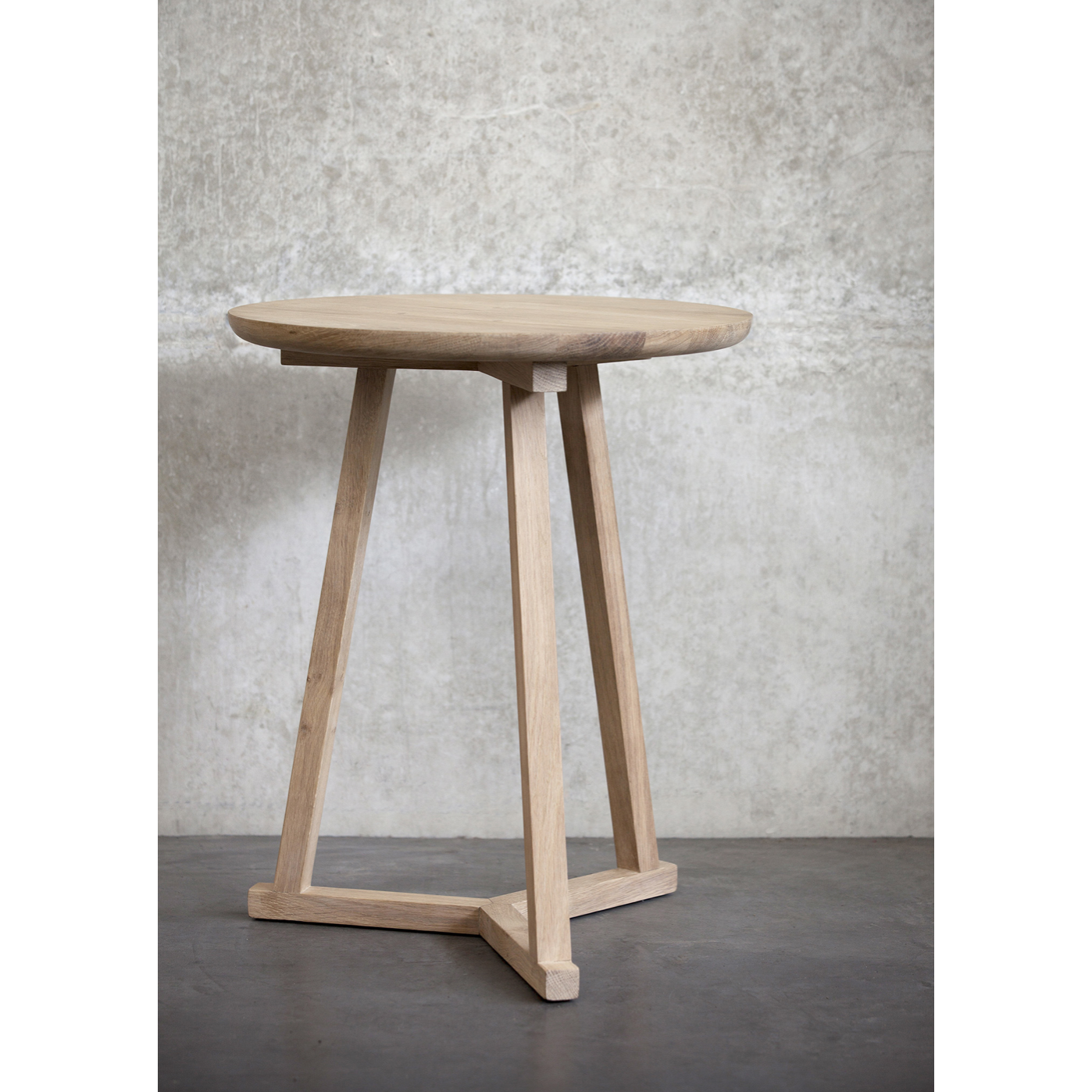 The Oak Tripod Side Table is a light, versatile piece that can be used on its own or in a group of several tables. It can easily be moved from room to room, placed next to a chair or a settee, or as a bedside table.  Dimensions: 18.5"w x 18.5"d x 22.5"h  Weight: 11 lbs  Material: Oak, 100% solid wood Finish: Varnished
