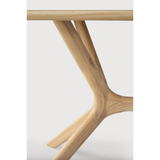 This Oak X Dining Table features sturdy, intricate construction of advance wood working. With a seamless structural interplay between the unique shape of the legs and the soft lines of the tabletop, guests will enjoy the most comfortable seating experience.  Designed by Alain van Havre Finish: Oiled