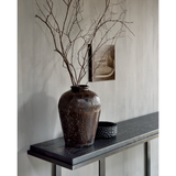 Featuring Stability Console Table - Umber by Ethnicraft at Amethyst Home. The deep surface of the Stability console is shaped by hand by skilled artisans. Natural mineral powders and color pigments blend to form the console's unique finish. We love how this piece's simple lines showcase the clean beauty of well-crafted metal work. We imagine this unique p.  Amethyst Home provides interior design, new home construction design consulting, vintage area rugs, and lighting in the Des Moines metro area.