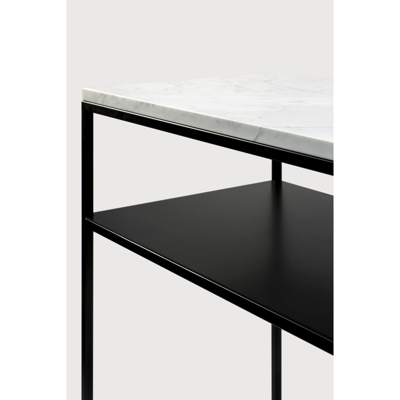  We love that the Stone console is an even mix of contemporary and glamorous elements bringing a touch of chic style to your entry way or living room. With its modern open metal frame and its pristine marble, we admire the simple lines and sleek design by designer, Djordje Cukanovic.  Dimensions: 47.5"w x 16"d x 34"h  Weight: 91 lbs  Material: Marble top, black metal frame