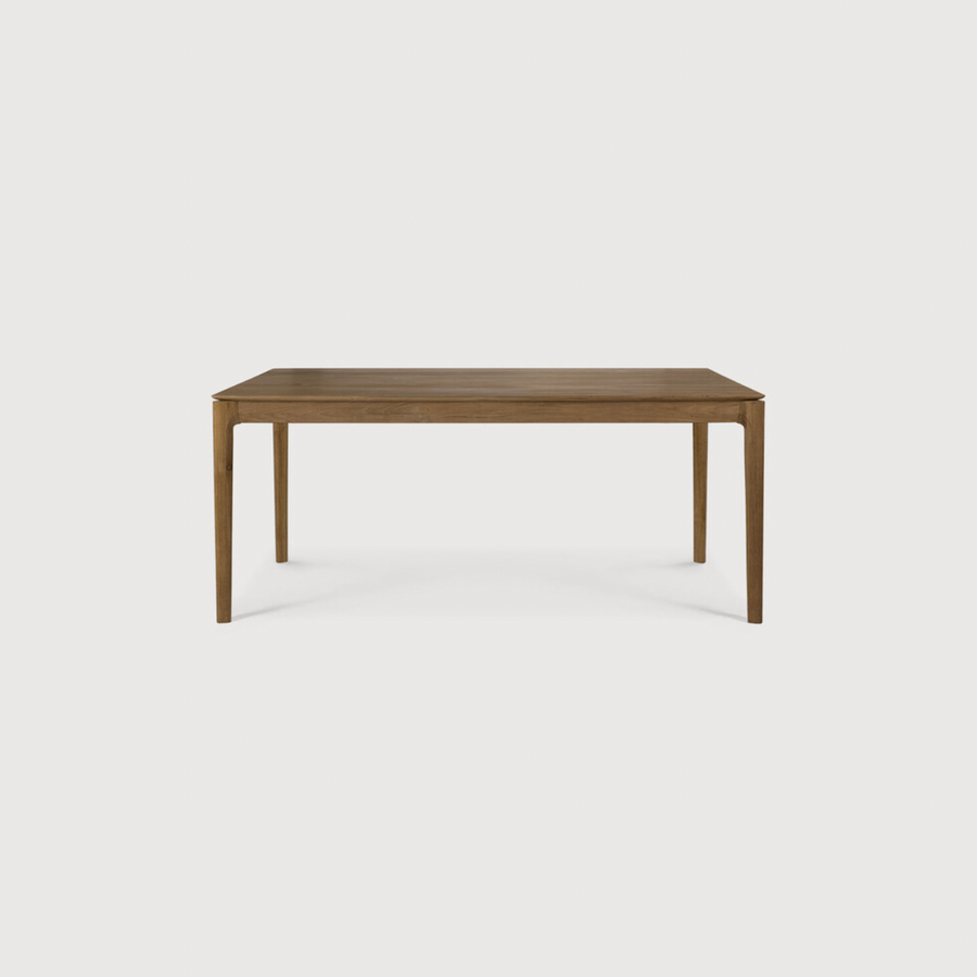 This Oak Bok Extendable Dining Table is perfect for families who want extra space when their kids, extended family, or guests come to celebrate! Its airy shape yet rock solid construction make this piece a timeless and remarkable design to enjoy for years to come.  Material: Oak, 100% Solid Wood Finish: Oiled