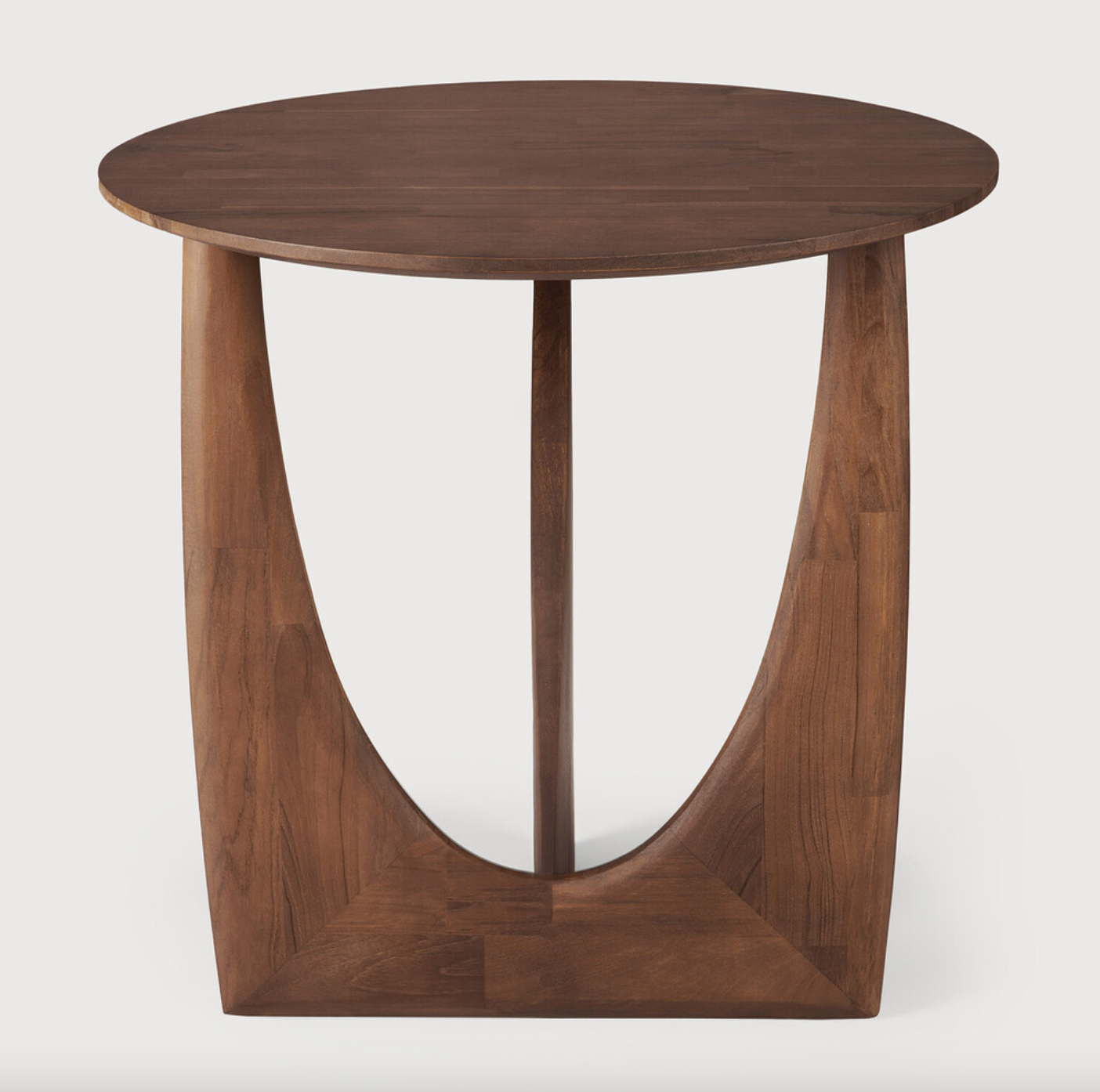 From any angle, the Teak Geometric Side Table does not only look different, it also becomes different. We love seeing this table as a sculptural accent to your living space or office.  Designed by Alain van Havre  Dimensions: 20.5"w x 20.5"d x 20"h  Weight: 11 lbs  Material: Teak Finish: Varnished