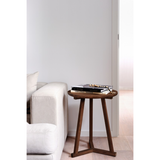 We love the versatility of this Teak Tripod Side Table. This can be placed next to a sofa, used as a bedside table, or grouped together with multiple tables for an interesting look!  Dimensions: 18.5"w x 18.5"d x 22.5"h   Material: Teak  Finish: Oiled