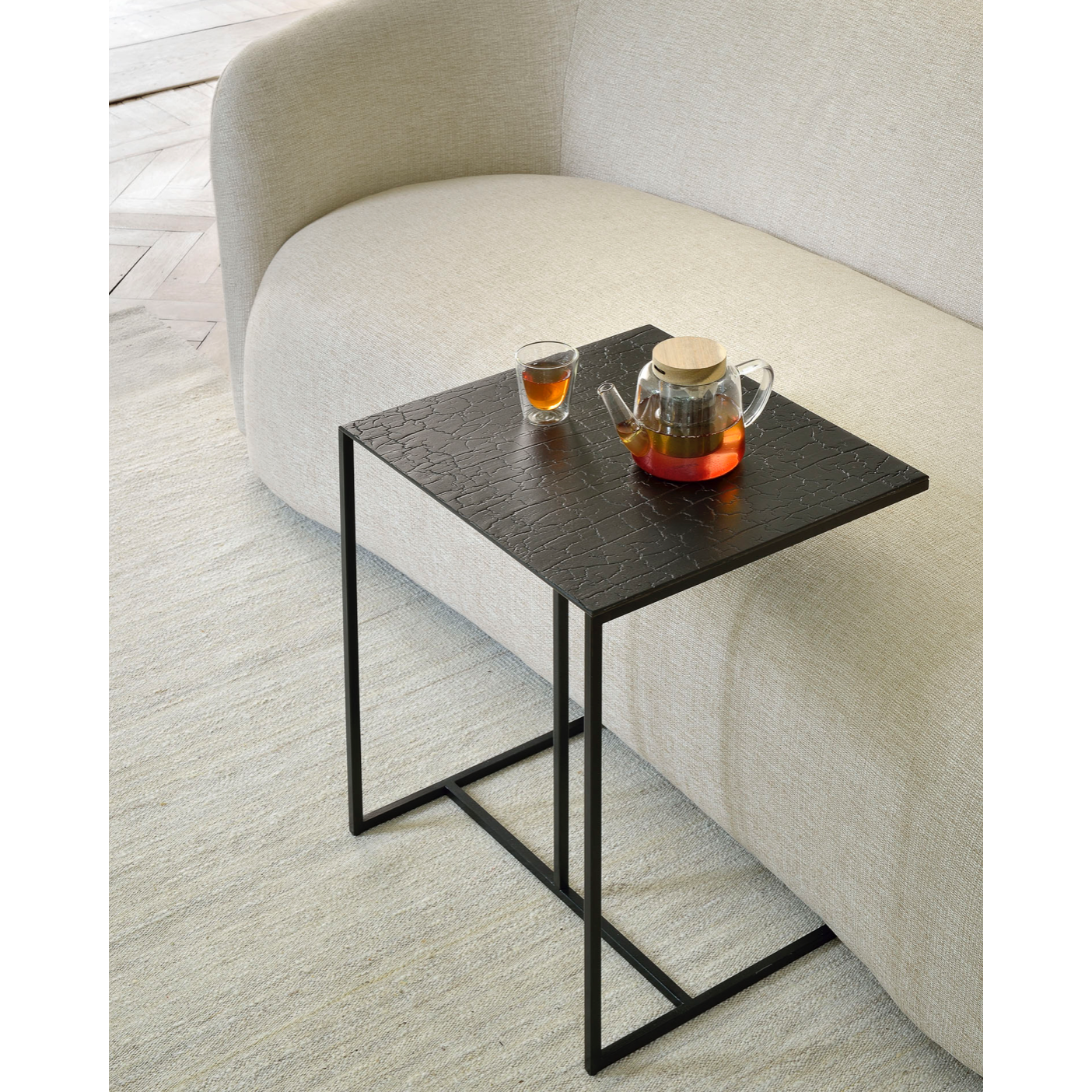 The Triptic table is a chic and practical side table that could sit perfectly with your sofa, ideal for a laptop or beverages. We love how this little table will elevate your living space aesthetically and functionally! We can't get enough of this distinctive table top finish that is made from mineral powders, water, earth, natural color pigments and metallic powders.  Dimensions: 18"w x 16"d x 20.5"h  Weight: 19 lbs  Material: Minerals  Finish: Metallic