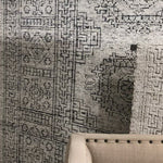 Hand-knotted in India of viscose and cotton, the Vestige White / Black Area Rug recalls ancient khotan rugs in an updated color palette. Soft underfoot, the silken yarns temper the graphic motifs to create a versatile foundation.  Hand Knotted 89% Viscose | 11% Cotton VQ-01 White / Black