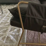 A nod to relaxed modernism, playing up the natural depth of exclusive top-grain leather, with buckle details and low-slung styling crafting the hippest of vibes.  Overall Dimensions: 28.00"w x 37.00"d x 35.00"h Seat Depth: 22" Seat Height: 20" Arm Height from Floor: 23.5" Arm Height from Seat: 3.5"