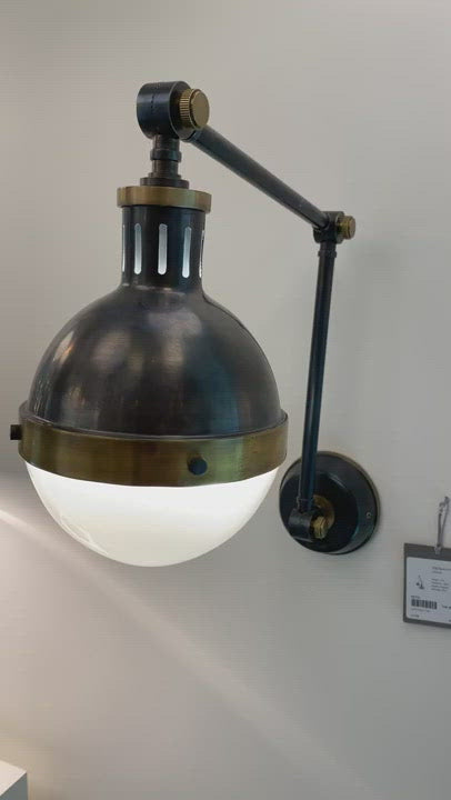 We love how the Hicks Library Light by Visual Comfort has two points of movement with a dimmer on the backplate. A classy, gorgeous lighting to add to your study, hallway, or other area needing extra light.  Designer: Thomas O'Brien
