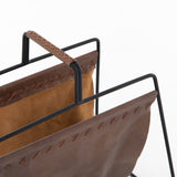 We love the cross-stitching details on this patina brown, top grain leather Aesop Magazing Rack. A gorgeous piece to place all your favorite magazines or important papers in, while also bringing a stylish mid-century vibe to your office or other space.  Overall Dimensions: 18.50"w x 11.75"d x 19.00"h Materials: Top Grain Leather, Iron Colors: Patina Brown, Smooth Jet Black
