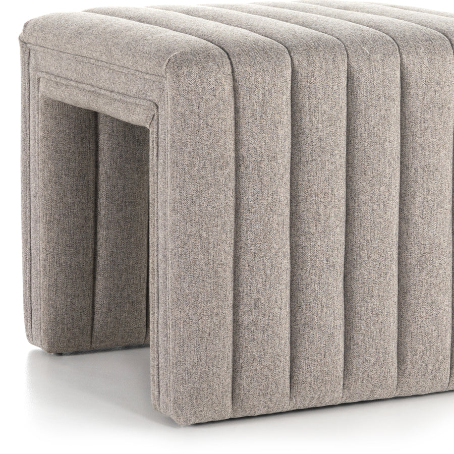 We love the dramatic channeling of this Augustine Ottoman - Orly Natural. Match it with the Augustine Swivel and complete the whole space!  Overall Dimensions: 21.50"w x 21.00"d x 18.00"h  Colors: Orly Natural Materials: 100% Polyester