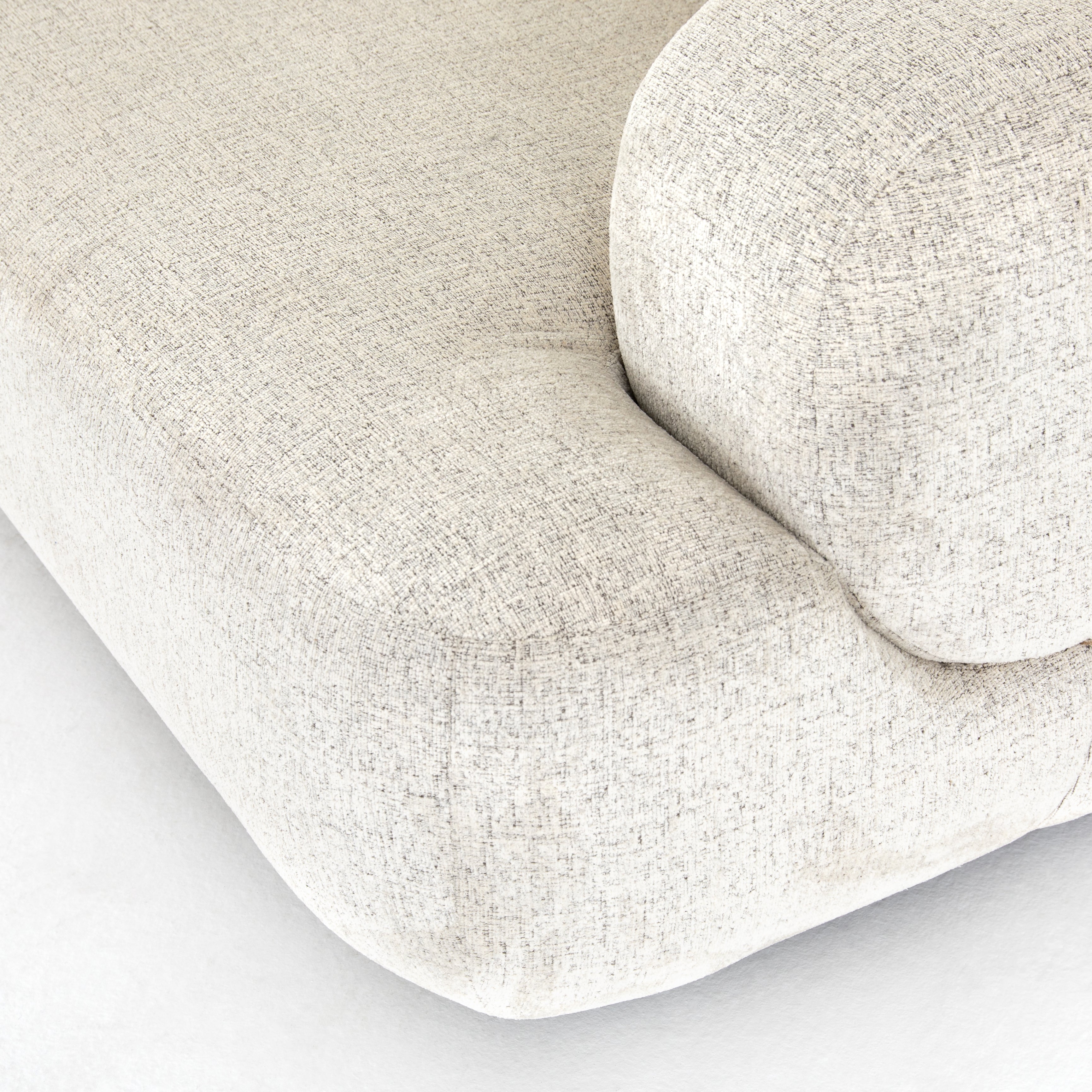 We love the chunky arms of this Benito 90" Sofa - Plushtone Linen. Plush chenille-like upholstery emits highs and lows for a refined look and textural feel with eye-catching highs and lows. Rounded edges and roomy seating space for any living room, den, or lounge area.   Overall Dimensions: 90.00"w x 40.00"d x 33.00"h