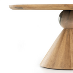This Bibianna Dining Table - Smoked Honey is a sculptural showstopper inspired by Italian design. Finished in a smoked honey, a cone-tapered parawood base supports a roomy, rounded tabletop separated by blush-finished marble detailing. Seats six comfortably.  Overall Dimensions: 60.00"w x 60.00"d x 30.50"h