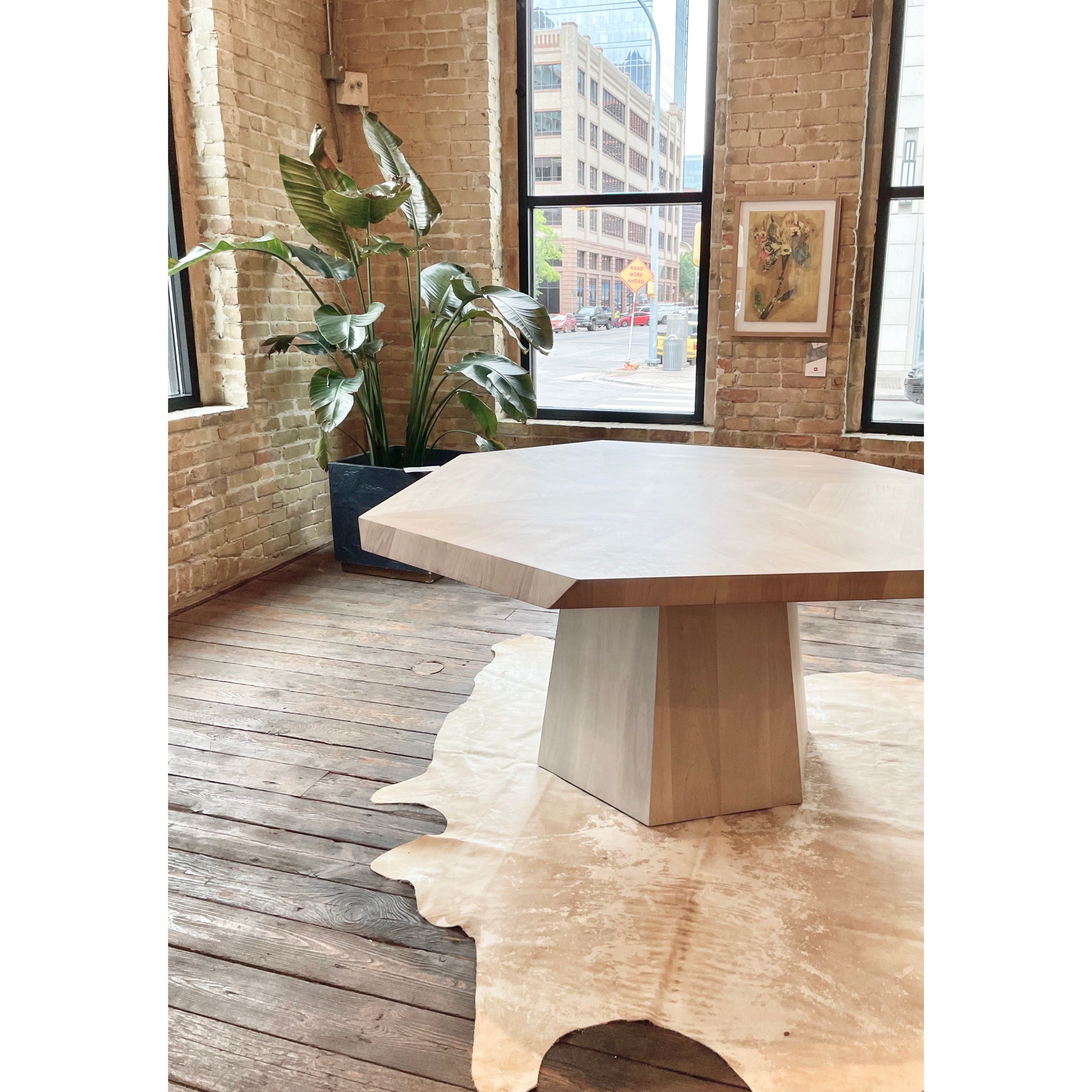 We love the symmetric sides that form a casual octagon of this Brooklyn Dining Table - Ashen Walnut. Light walnut veneer is blended and smoothed for a soft look with rich depth. Each style slightly unique, thanks to materials' natural quality.  Overall Dimensions: 60.00"w x 60.00"d x 30.00"h