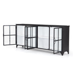 A black iron frame with windowpane detail contrasts a stark white interior for an updated take on the traditional media console. Open-front glass doors and ample shelving maximize storage and display options.  Size: 94.50"w x 16.00"d x 39.50"h Colors: Tempered Glass, Painted White, Black Materials: Glass, Iron