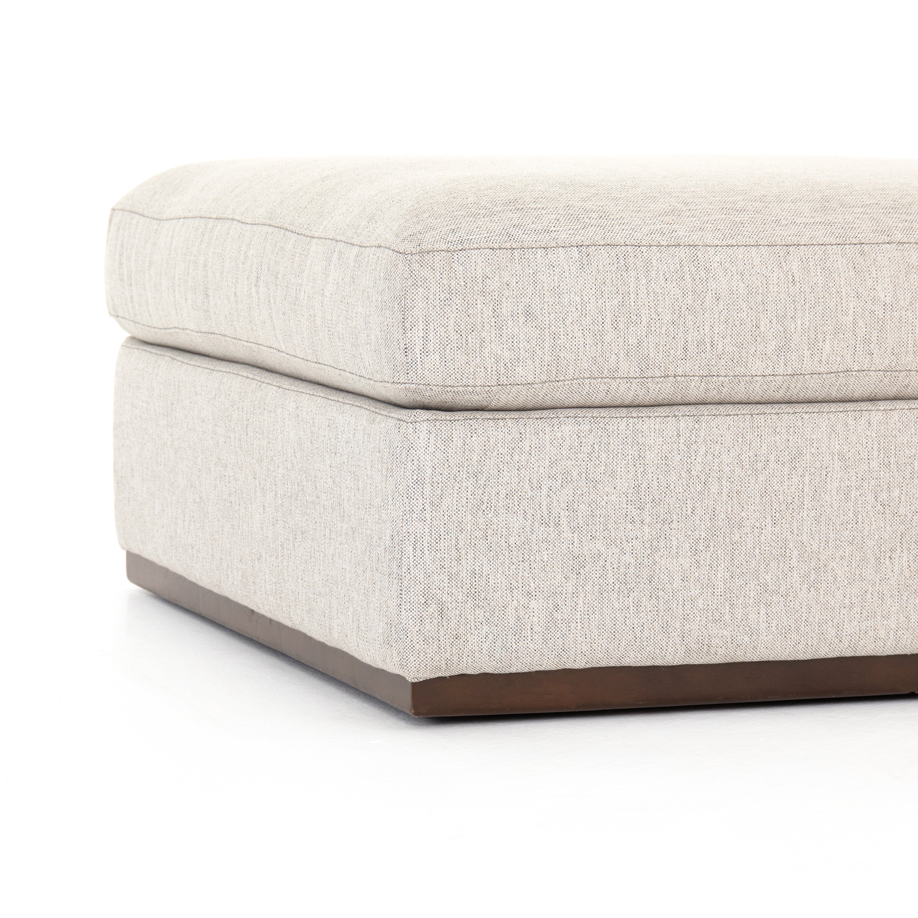 This Colt Ottoman - Aldred Silver has a textural poly/linen blend with a gorgeous wood base. A shapely and simply styled ottoman to add to your living room or lounge area.   Overall Dimensions: 35.50"w x 35.50"d x 18.00"h