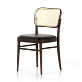 Inspired by the Thonet chair popularized in the mid-century, this Court Dining Chair - Noir features dark, solid ash and forms a simple-but-shapely frame for black polyfoam seating and a natural cane back.  Overall Dimensions: 17.75"w x 21.25"d x 31.75"h
