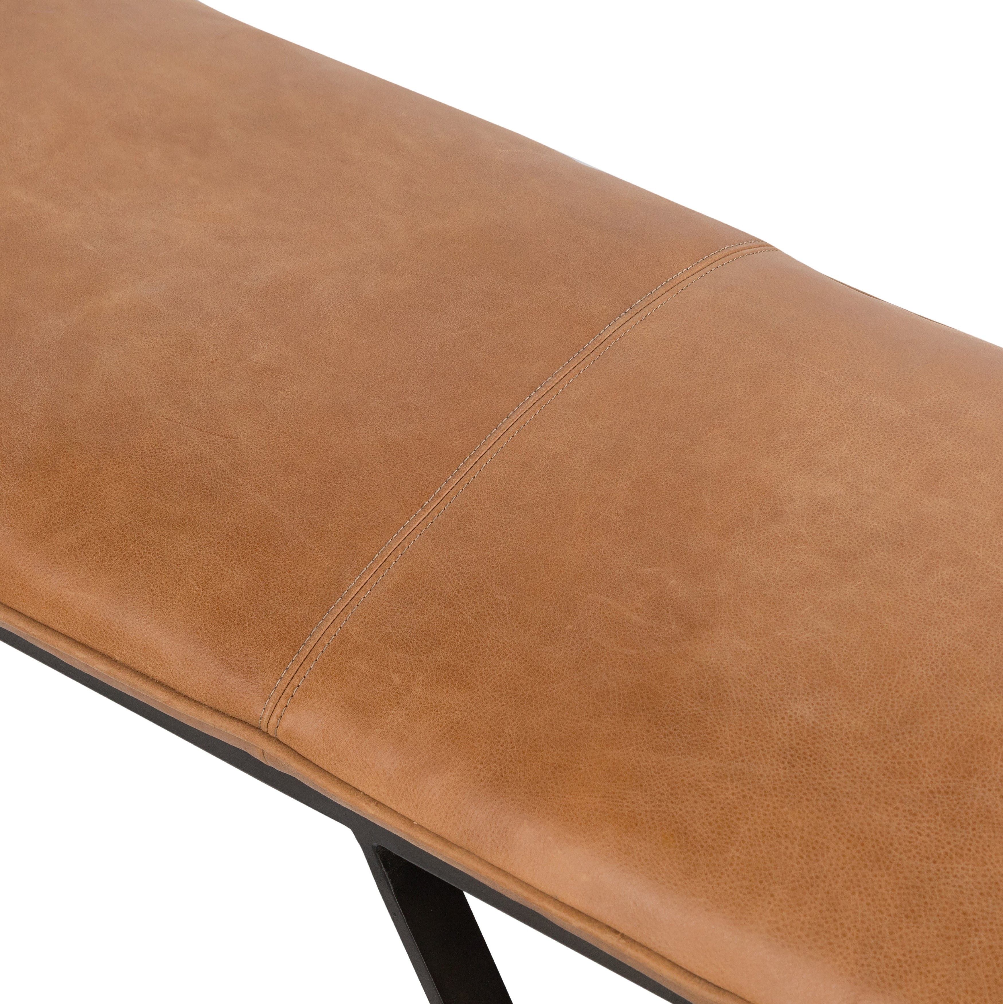 The Darrow Bench -  Palermo Cognac is a time-honored bench, reinvented. With fresh, clever shaping, angular gunmetal-finished iron supports spare-yet-comfortable top-grain leather cushioning in a rich cognac.  Overall Dimensions: 63.50"w x 17.50"d x 17.75"h