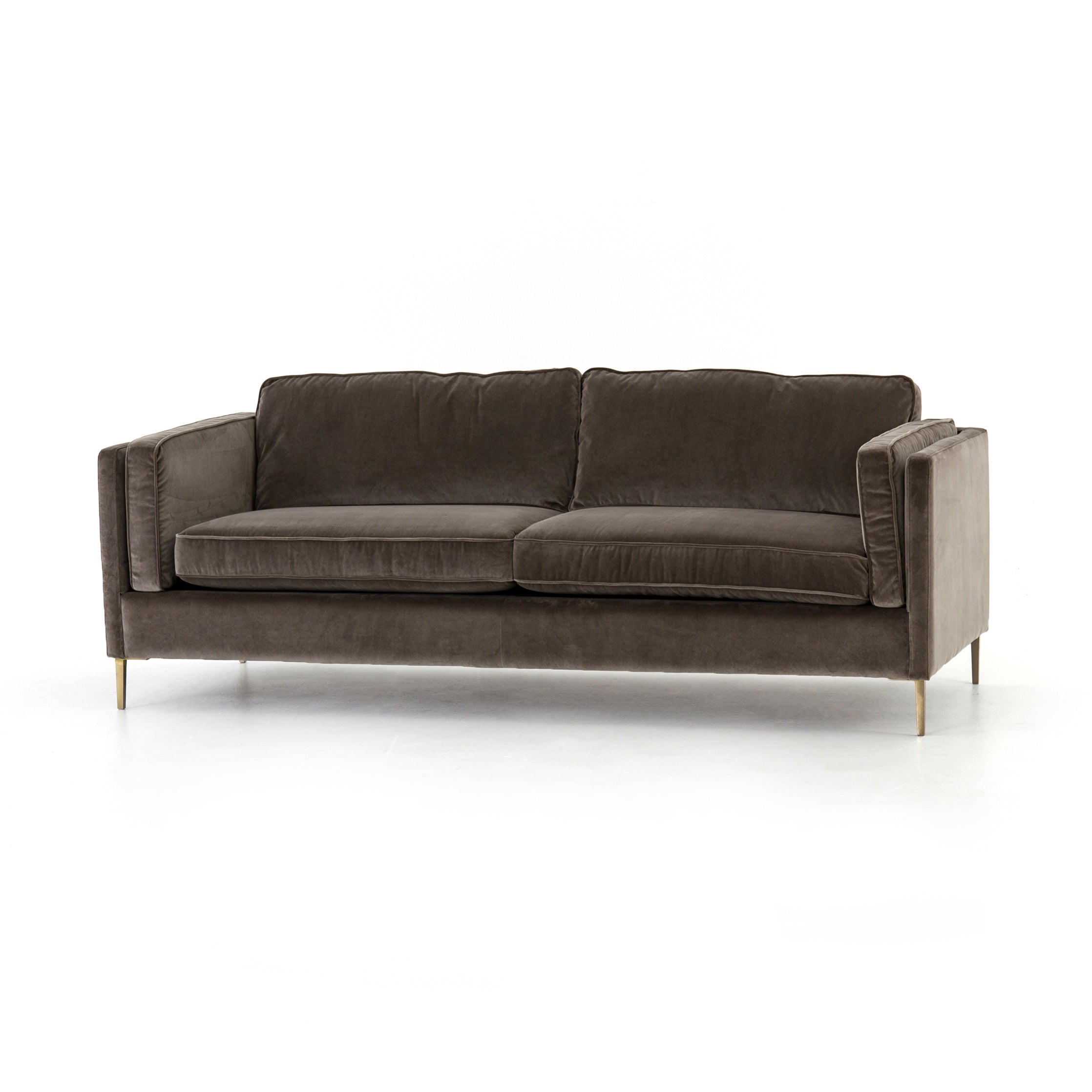 We love the plush brich-grey upholstery of this Emery Sofa - Sapphire Birch. The slim legs are finished in a gorgeous antique brass, for a sophisticated look for any living room or lounge area.   Overall Dimensions: 84.00"w x 36.00"d x 33.00"h