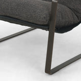 This Emmett Sling Chair - Thames Ash is super stylish and effortlessly cool. Sling-style seating of grey performance-grade upholstery exclusive to Four Hands sits low and curved for a fresh take on a throwback form. Industrial iron framing turns up the drama for any living room or office.   Overall Dimensions: 29.00"w x 36.00"d x 29.00"h Seat Depth: 20.0"
