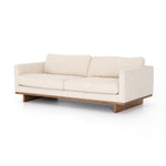 Classic goes contemporary with this Everly Sofa - Irving Taupe. A cocoa-finished parawood base supports low, deep seating of performance-grade upholstery in an invitingly neutral taupe, with track arms for a clean touch for any living room or lounge area.   Overall Dimensions: 84.00"w x 43.00"d x 32.00"h