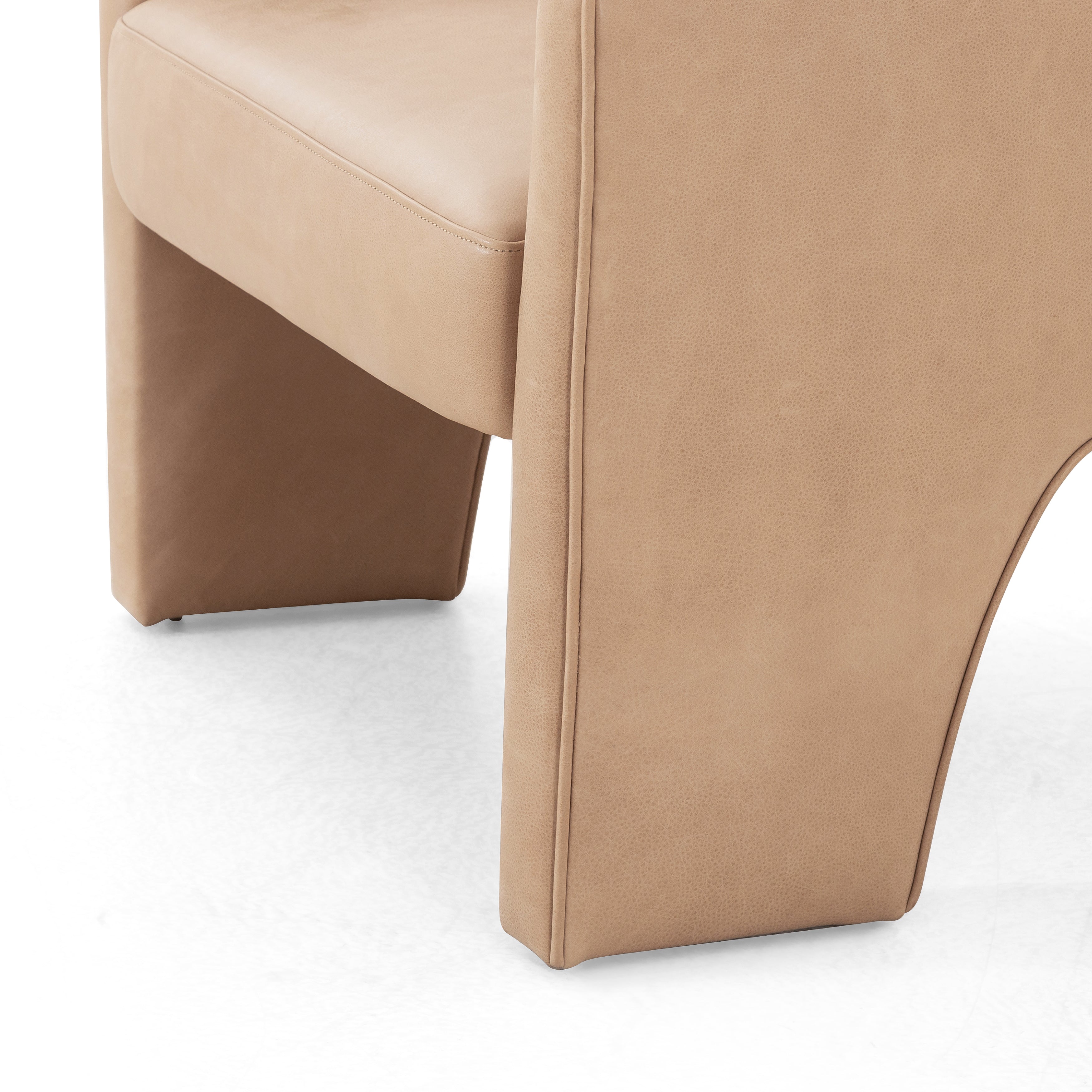 This Fae Chair - Pallermo Nude is well-tailored and stylistically unique. The top grain leather lends a high-fashion feel to a cleverly constructed three-legged design.  Overall Dimensions: 30.25"w x 29.50"d x 29.50"h