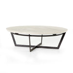 We love the textured top and geometric base of this Felix Round Coffee Table - Sandblasted White Marble. Place in your living room or lounge area to bring a sophisticated look to the space.  Overall Dimensions: 48.00"w x 48.00"d x 15.00"h Colors: Rustic Fossil, Sandblasted White Marble Materials: Iron, Marble Weight: 189.6 lb